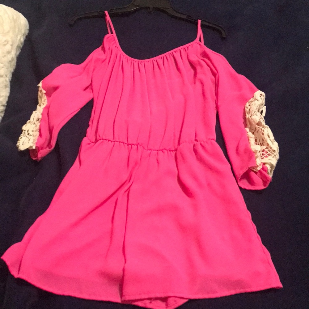 Cute hot pink boutique romper. Nice for the spring or summer time. Size S/M